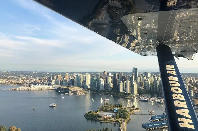 View from under a Harbour Air wing over Coal Harbour and downtown Vancouver